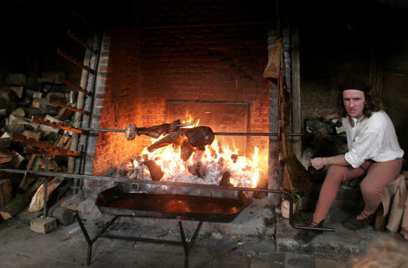 Meat is roasted over the fire in the kitchens at Hampton Court Palace, in the same way it was once cooked for King Henry VIII.