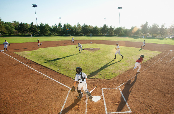 Young kids playing a game of baseball