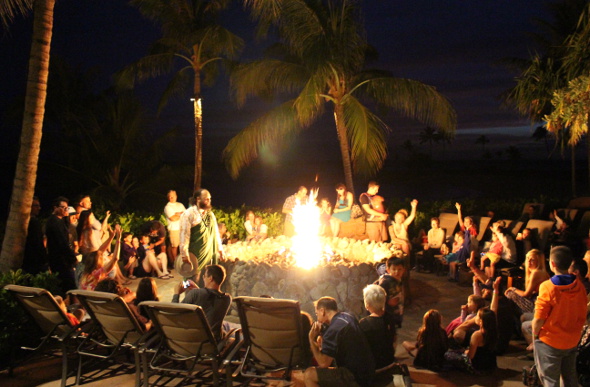 Families gather around the fire pit for story time at Disney Aulani Resort in Hawaii