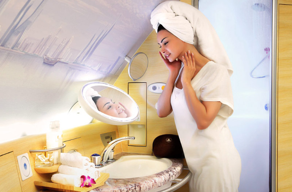 A woman enjoy the Shower Spa in Emirates A380 First Class