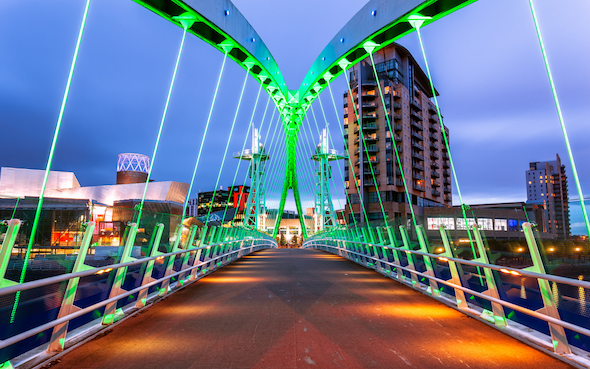 A pedestrian bridge at Manchester's Salford Quays waterfront precinct. Picture: Getty Images
