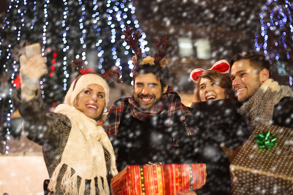 Smiling people celebrate Christmas in Europe.