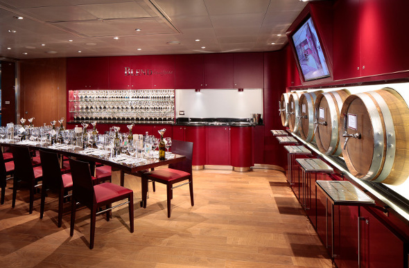 Wine barrels line the walls at BLEND, where you can create your own drop on board Holland America Line's MS Koningsdam.