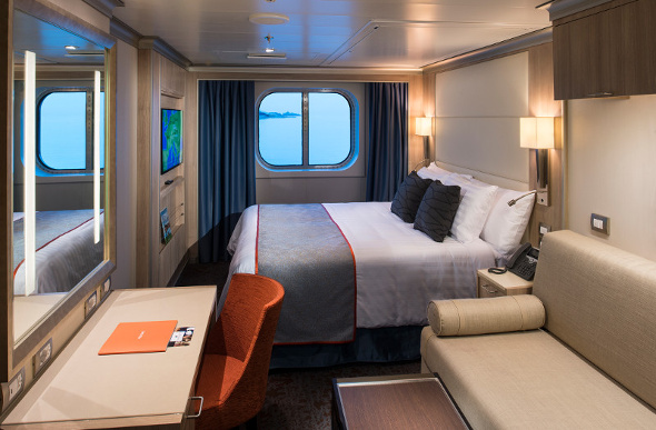  A family room on Holland America Line's MS Koningsdam affords a view of the ocean.