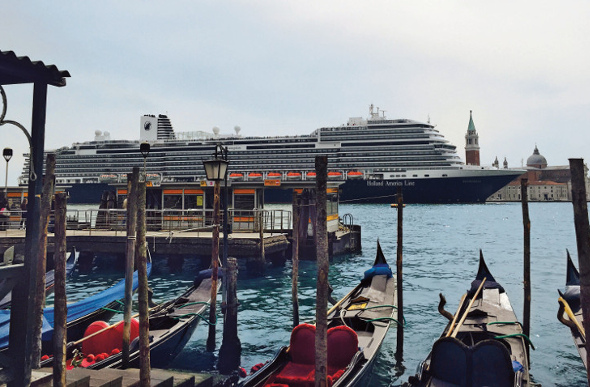  The MS Koningsdam rises above the moored gondolas in Venice.