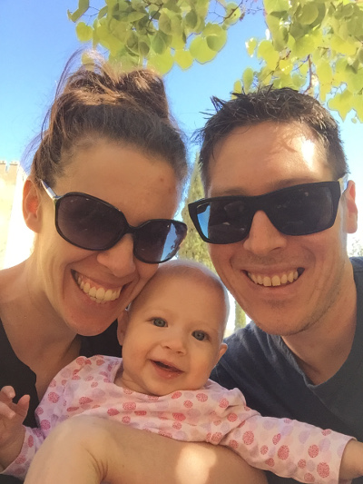 A mother, baby and father take a selfie in Granada, Spain