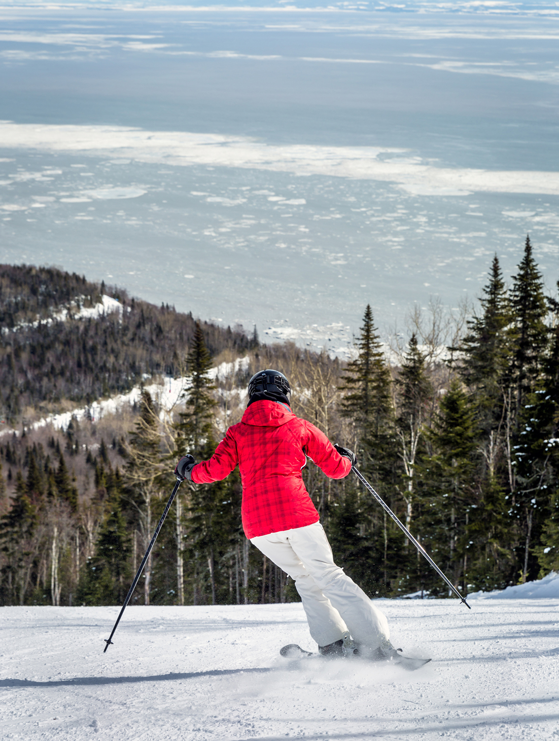 A woman skies down Le Massif in Charlevoix