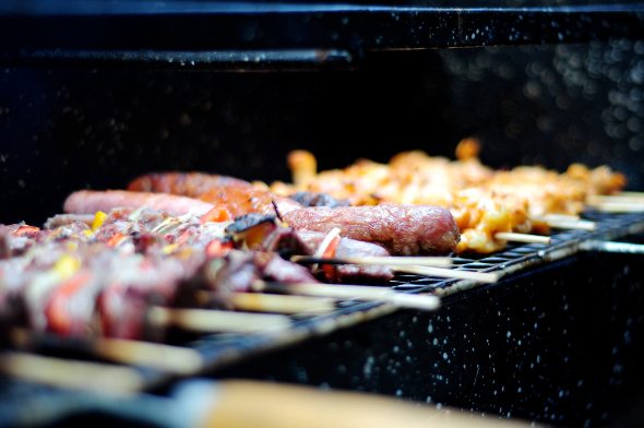 skewers of meat grilling on the barbecue