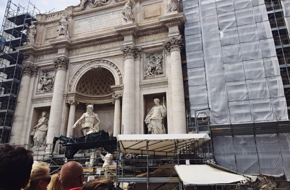 The famous Trevi Fountain is obscured by scaffolding while undergoing maintenance
