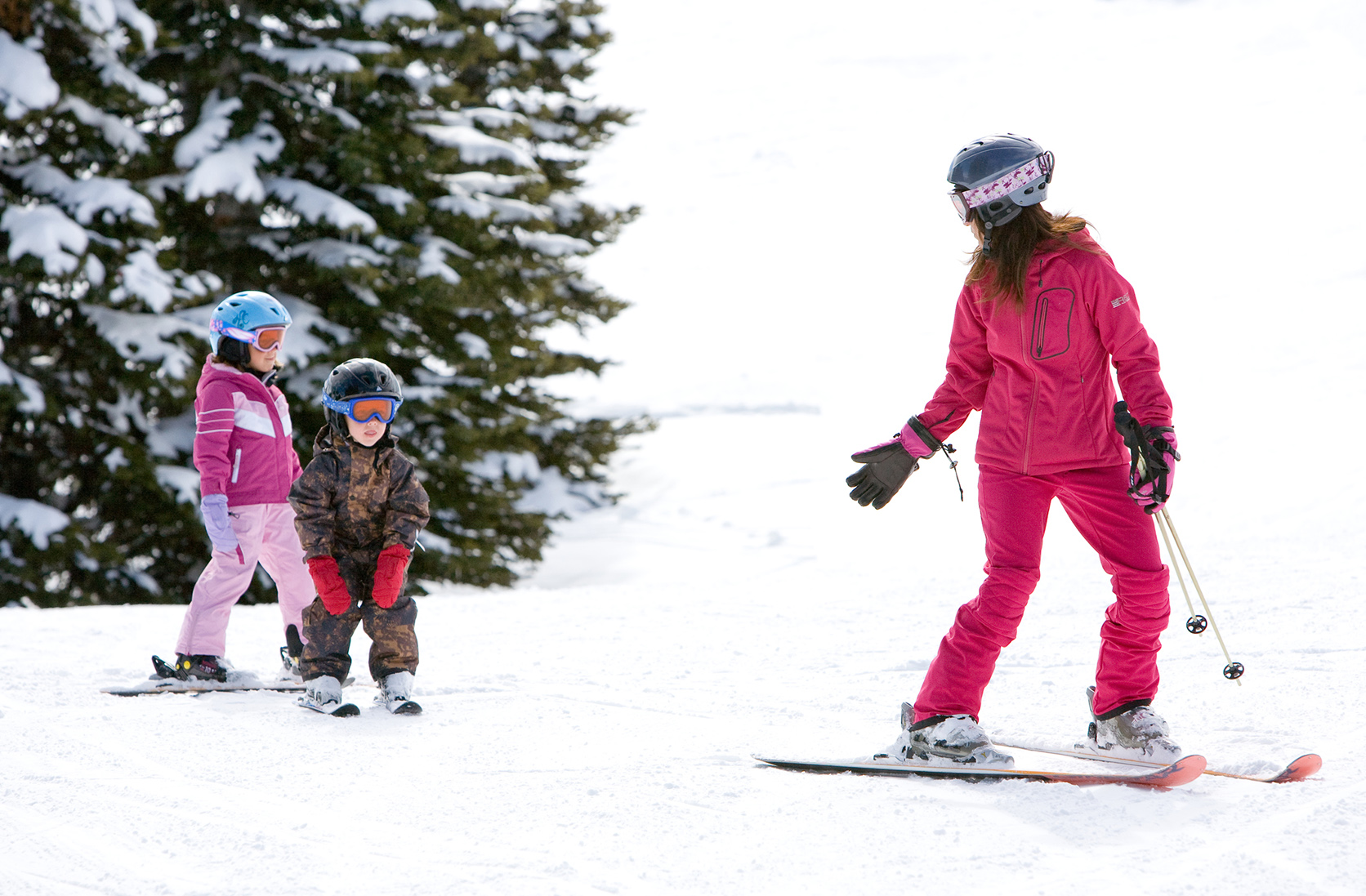 A mother and two children skiing at Whistler Blackcomb
