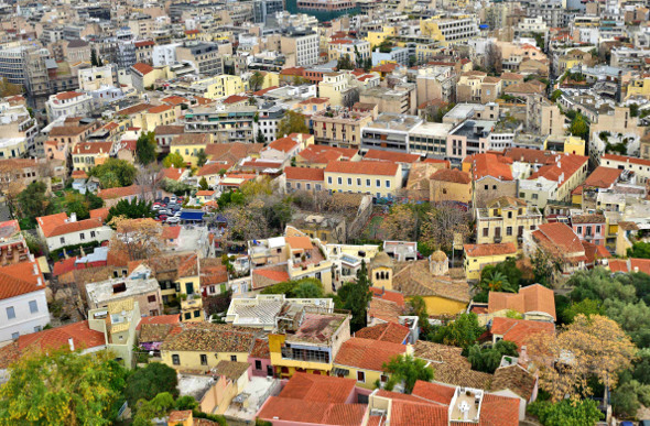 Pastel-coloured houses in Plaka below the Acropolis