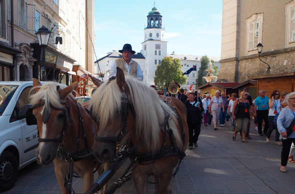 A horse-drawn carriage and people in Salzburg