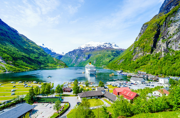 A cruise ship surrounded by fjords in Norway
