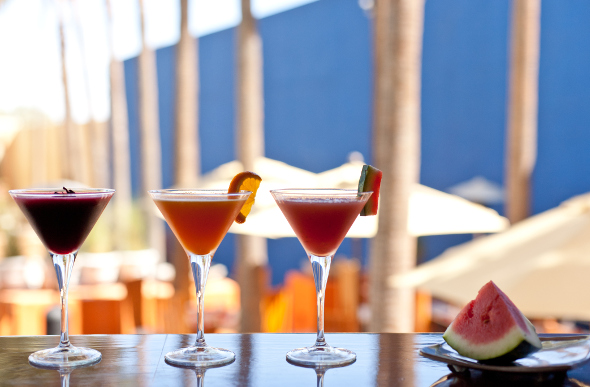 Cocktails sitting on a bar counter