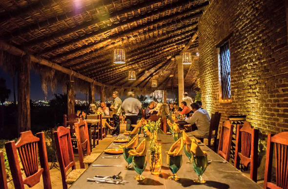 People sitting around a table at Los Tamarindos