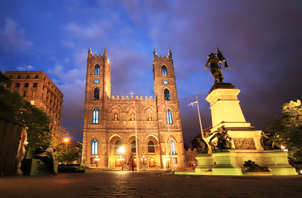 Montreal's Notre-Dame Basilica is lit up at night.