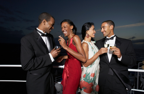 Four friends in formal attire on a cruise ship