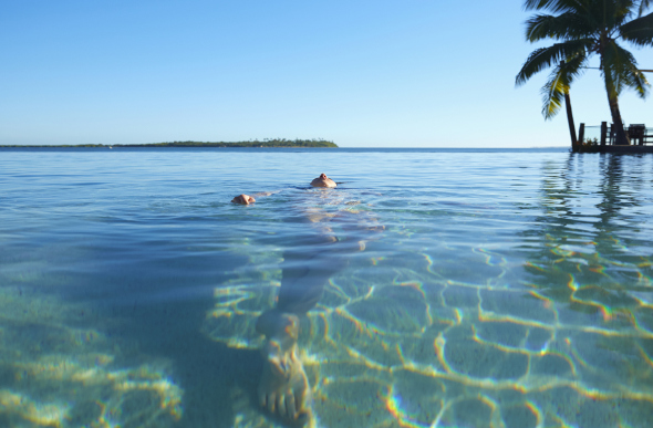 Woman swimming in Fiji
