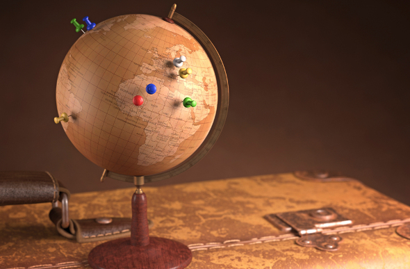 A globe with pins in it