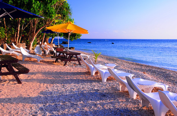 Beach chairs near the ocean on Hideaway Island