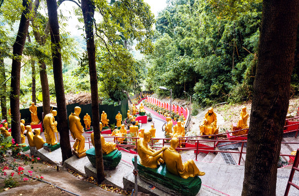 Buddhas line the steps at Ten Thousand Buddhas Monastery in Hong Kong. Picture: Getty Images