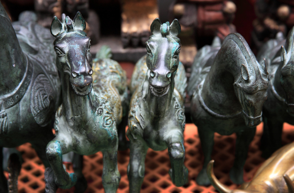 Bronze horses for sale at Upper Lascar Row, also known as Cat Street, in Hong Kong.