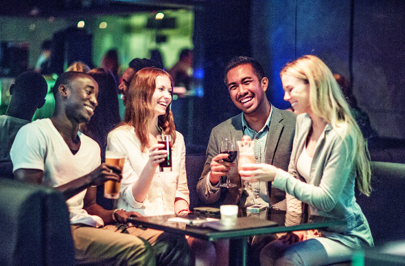 Friends gather for a drink in Hong Kong.