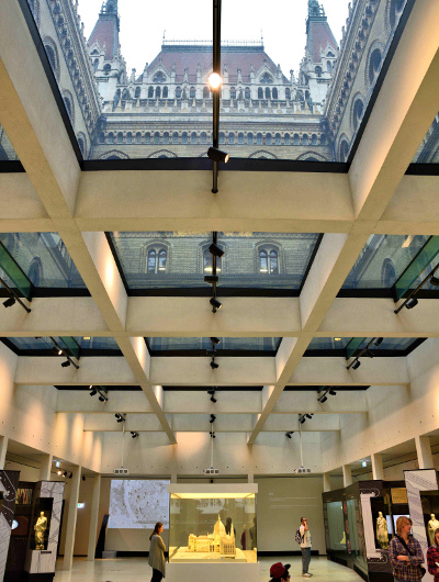 Museum with glass roof looking up at Hungarian Parliament Building