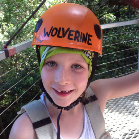 A young daredevil kitted out and raring to go on a Jungle Surfing Canopy Tour of the Daintree rainforest.