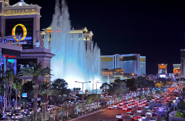 Cars driving past the Bellagio fountain in Vegas