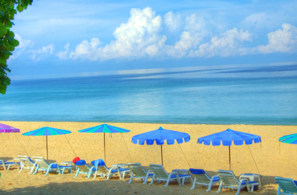 Movenpick Resort & Spa Karon Beach overlooks the sparkling waters of Karon Beach in Phuket, Thailand.
