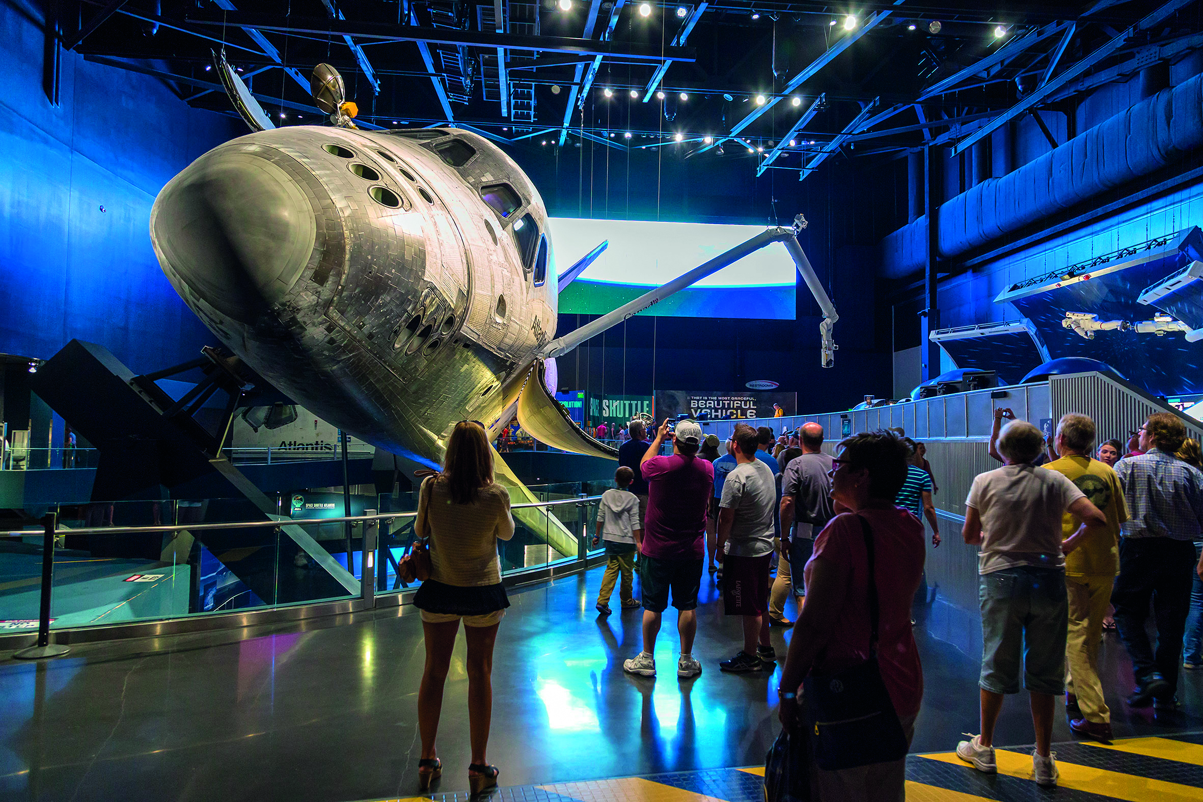 Adults and children alike marvel at the Space Shuttle at the Kennedy Space Centre.
