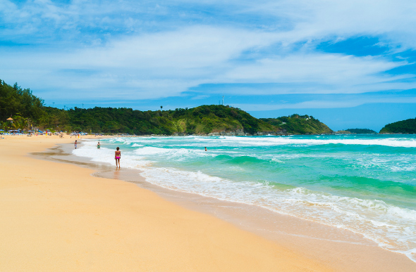 Yellow sand and bright blue water on Nai Harn Beach