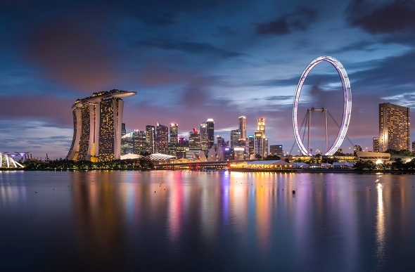 Twilight scene of downtown city skyline along Marina Bay, Singapore.