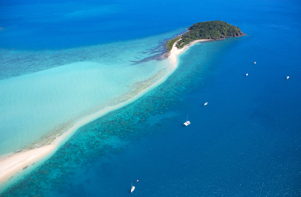 Langford Island beach is a narrow strip of sand among the coral of the Great Barrier Reef in the Whitsundays.