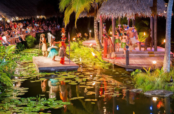 Performers dance on a floating stage at Te Vara Nui village in Rarotonga
