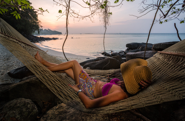 Woman lazing in a hammock on Phi Phi Island