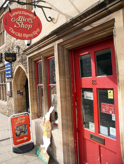 The red door and sign to Alice's Shop in Oxford