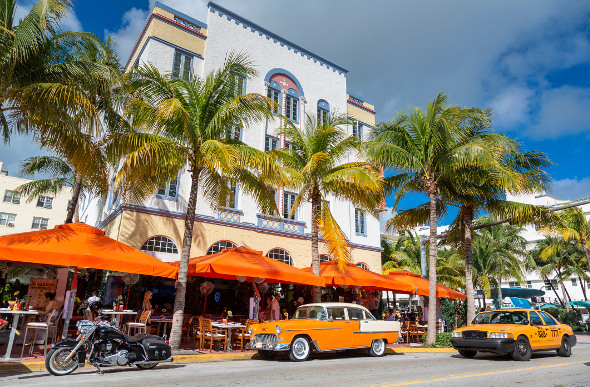 Vintage car parked outside a hotel in Miami