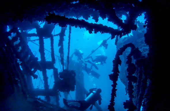 Group of divers exploring President Coolidge wreck in Vanuatu