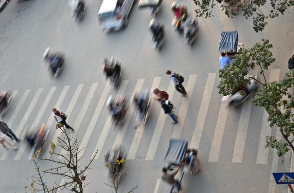 Pedestrians try to cross the road in Ho Chi Minh City, Vietnam.