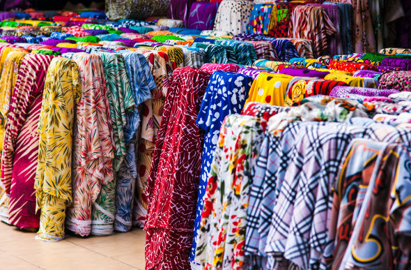 Brightly coloured bolts of fabric for sale at a Ho Chi Minh City market in Vietnam.