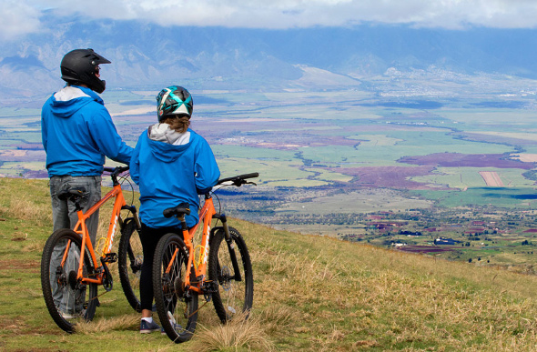Cyclists at a lookout on Haleakala, Hawaii.