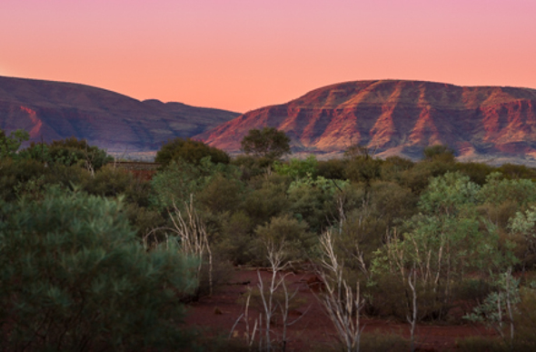 The sky turns pink in Karijini National Park, Western Australia.