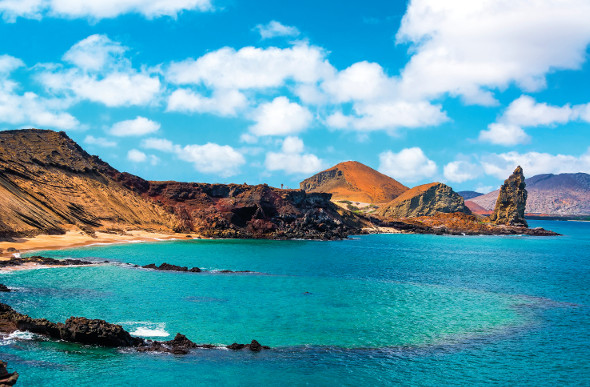 The blue-green waters and barren-looking hillsides of the Galapagos Islands.