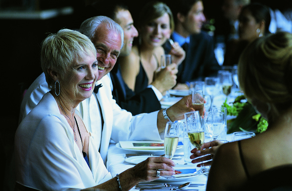 Cruise passengers enjoying dinner in formal wear