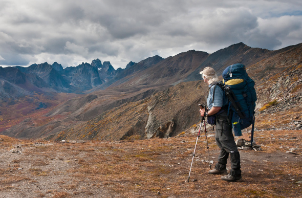 A man hiking along mountains in Yukon