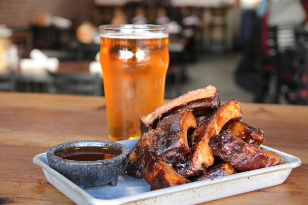 A plate of ribs and a pint of beer at Southpaw