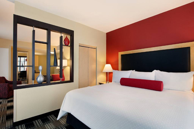 The interior of a Cambria Suites hotel room