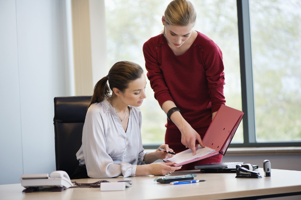Personal assistant working with business woman